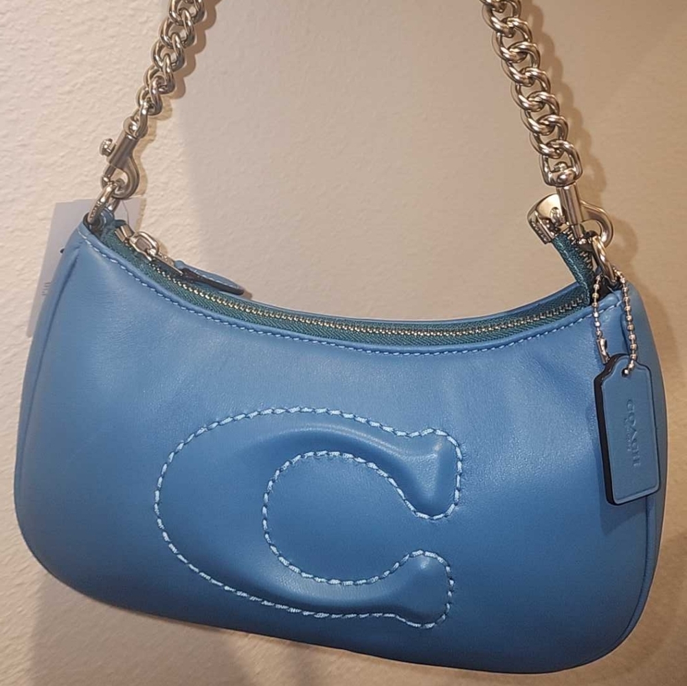 Coach NWT silver, bright blue, soft cloud feel, metallic + guitar strap
